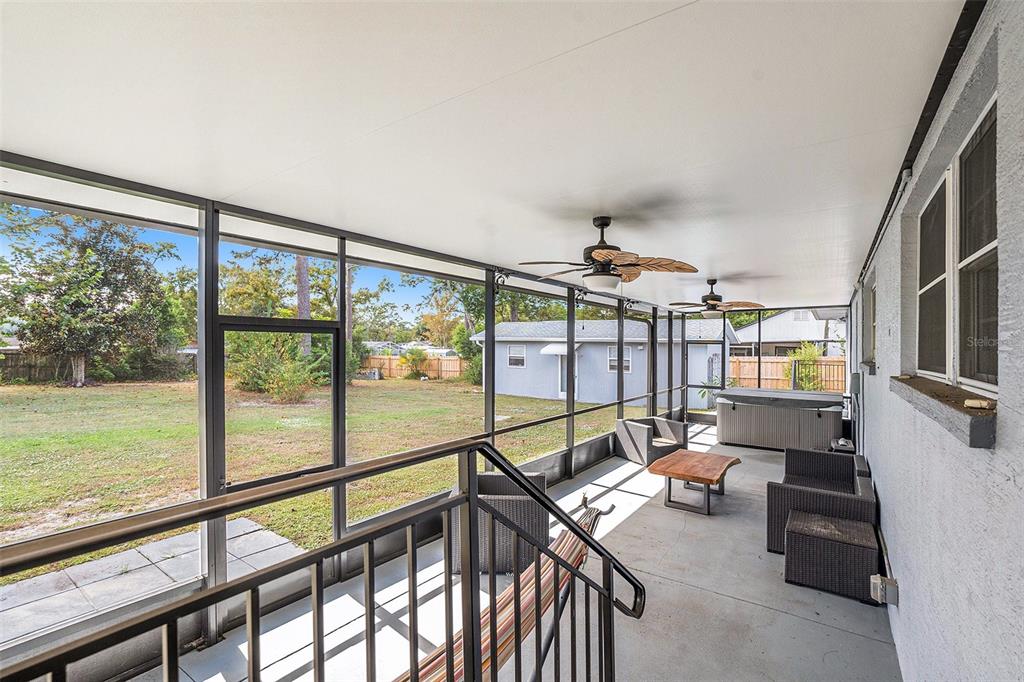 9738 Ray Street Hudson, FL 34669 - Photo 23 of 30 a living room with large windows