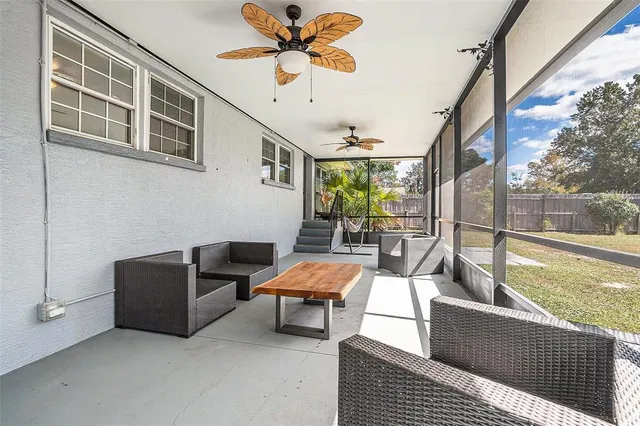 a outdoor living space with furniture and a potted plant
