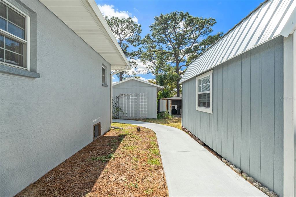 9738 Ray Street Hudson, FL 34669 - Photo 25 of 30 a house with trees in front of it