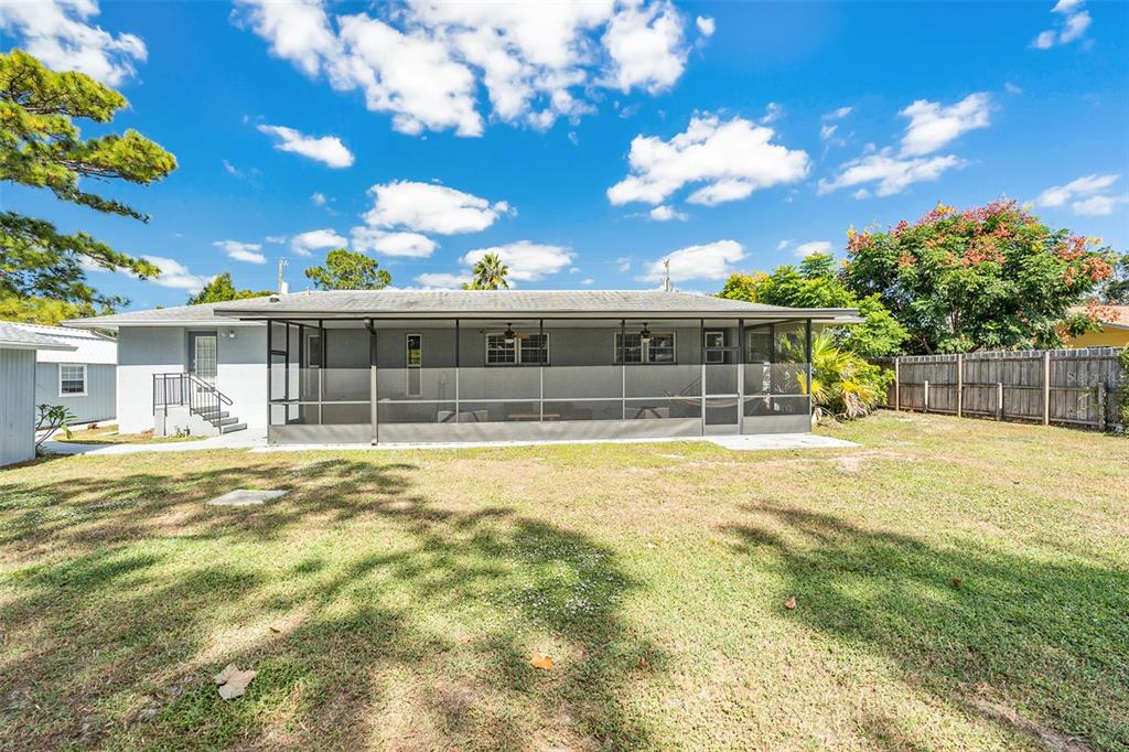 9738 Ray Street Hudson, FL 34669 - Photo 27 of 30 a view of a house with a swimming pool