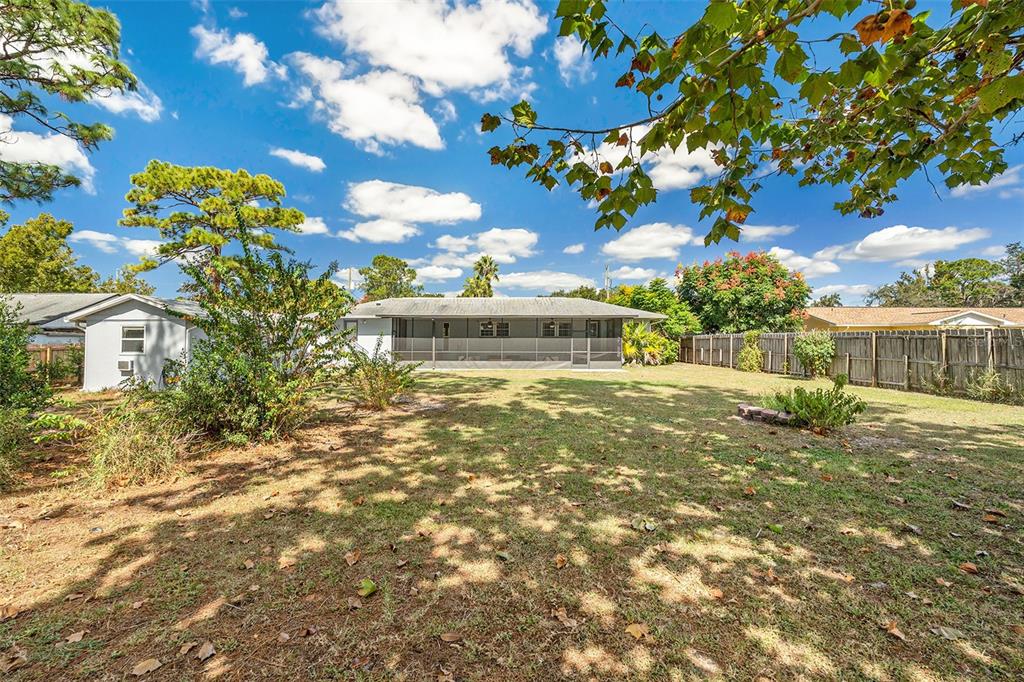 9738 Ray Street Hudson, FL 34669 - Photo 30 of 30 a view of a house with a yard