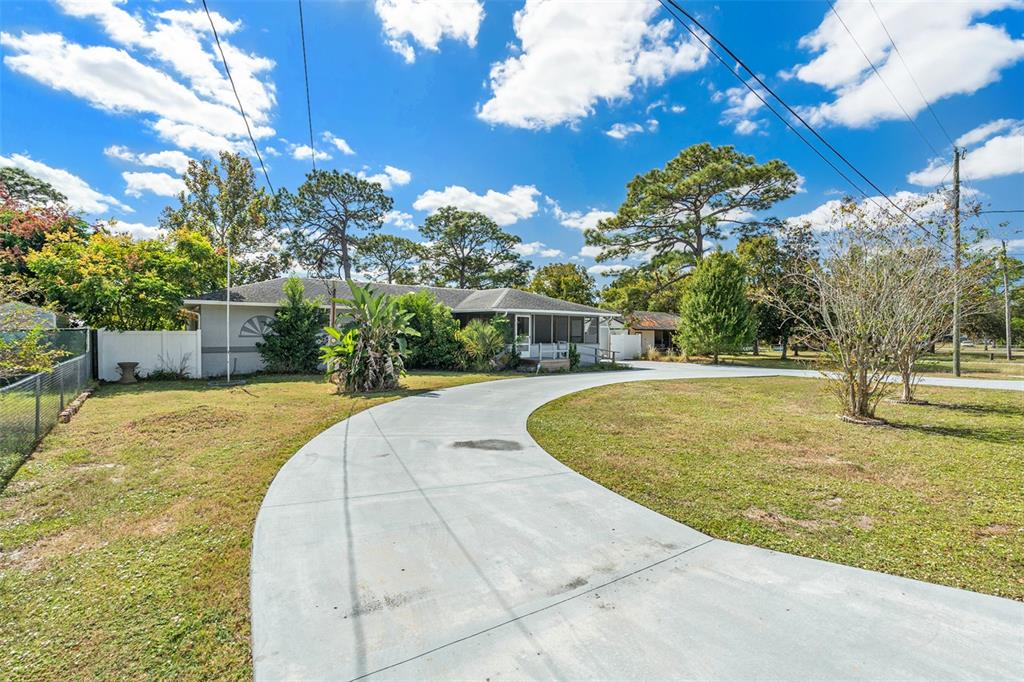 9738 Ray Street Hudson, FL 34669 - Photo 3 of 30 a view of outdoor space yard and swimming pool