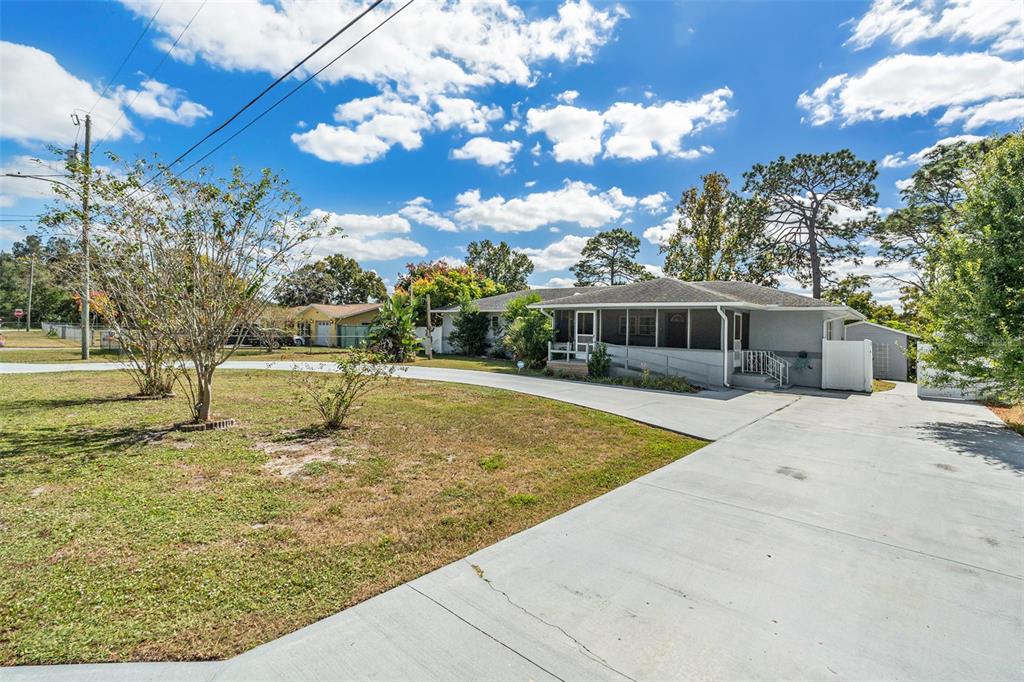 9738 Ray Street Hudson, FL 34669 - Photo 4 of 30 a view of a swimming pool with an outdoor seating
