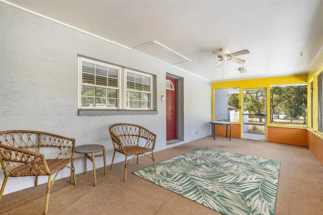a bedroom with furniture and a window