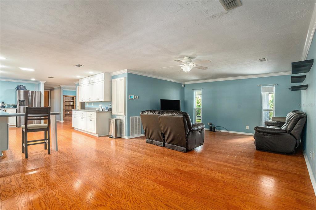 9738 Ray Street Hudson, FL 34669 - Photo 10 of 30 a living room with furniture and kitchen view