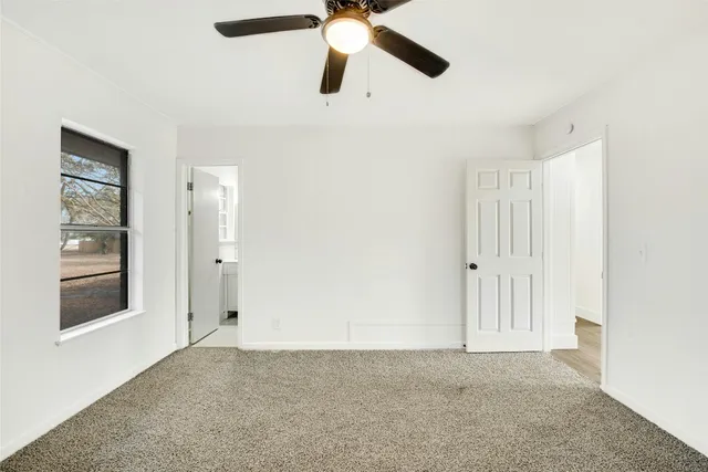 a view of an empty room and window