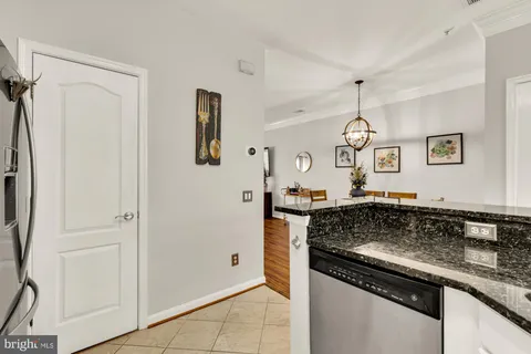 a kitchen with a sink stove and refrigerator