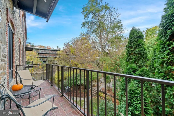 a view of balcony with furniture