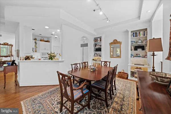 a dining room with furniture and wooden floor