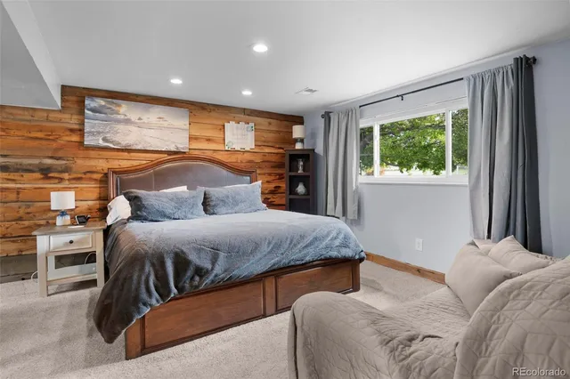 a bedroom with two beds and a window