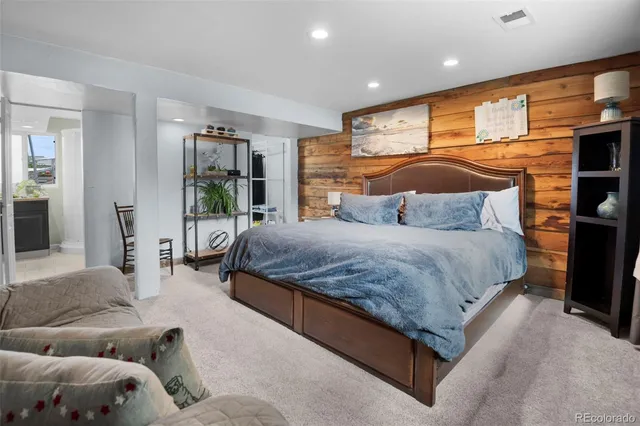 walk in closet with clothes and shoes