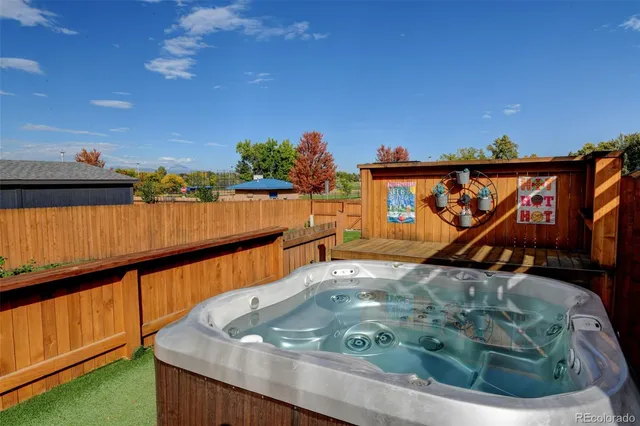 a view of a garden with lawn chairs