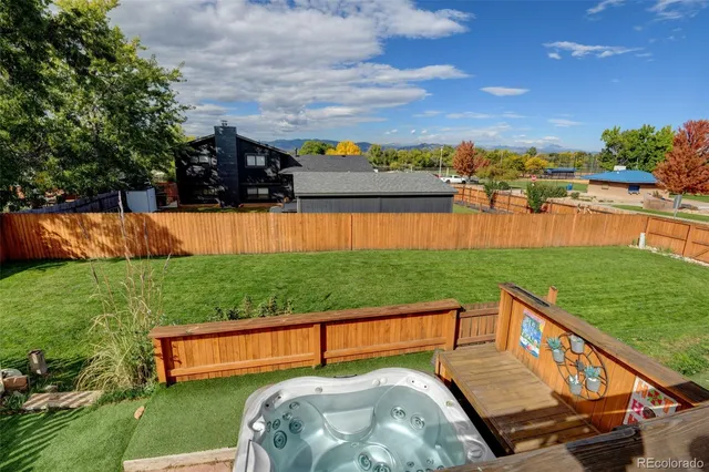 an aerial view of a garden with an outdoor seating