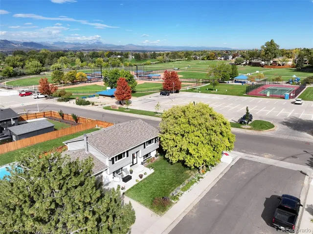 an aerial view of a house with a ocean view