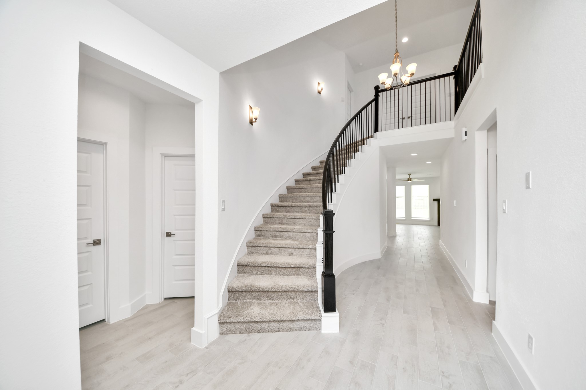 3102 Native Spg Drive Spring, TX 77373 - Photo 6 of 47 As you step into the threshold of this luxurious home, you'll soon be welcomed by an elegant glass door (to be installed). Inside, soaring ceilings amplify the spaciousness, while the refined wood-look tile flooring and oversized baseboards exude sophistication and charm.