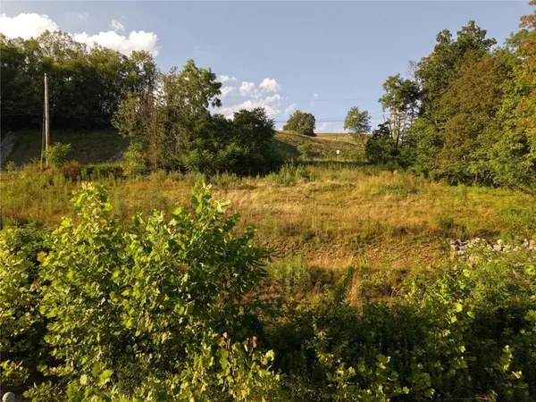 a view of a lake with a building in the background