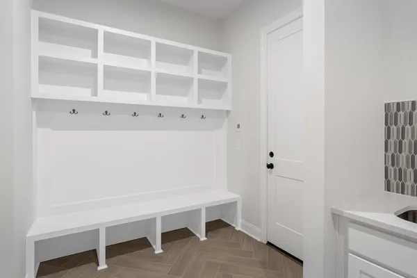 a view of a bathroom with a sink cabinet and a window