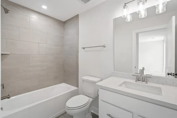 a view of a small space with wooden floor and a window