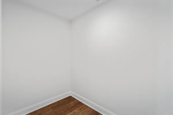 a view of a balcony with wooden floor