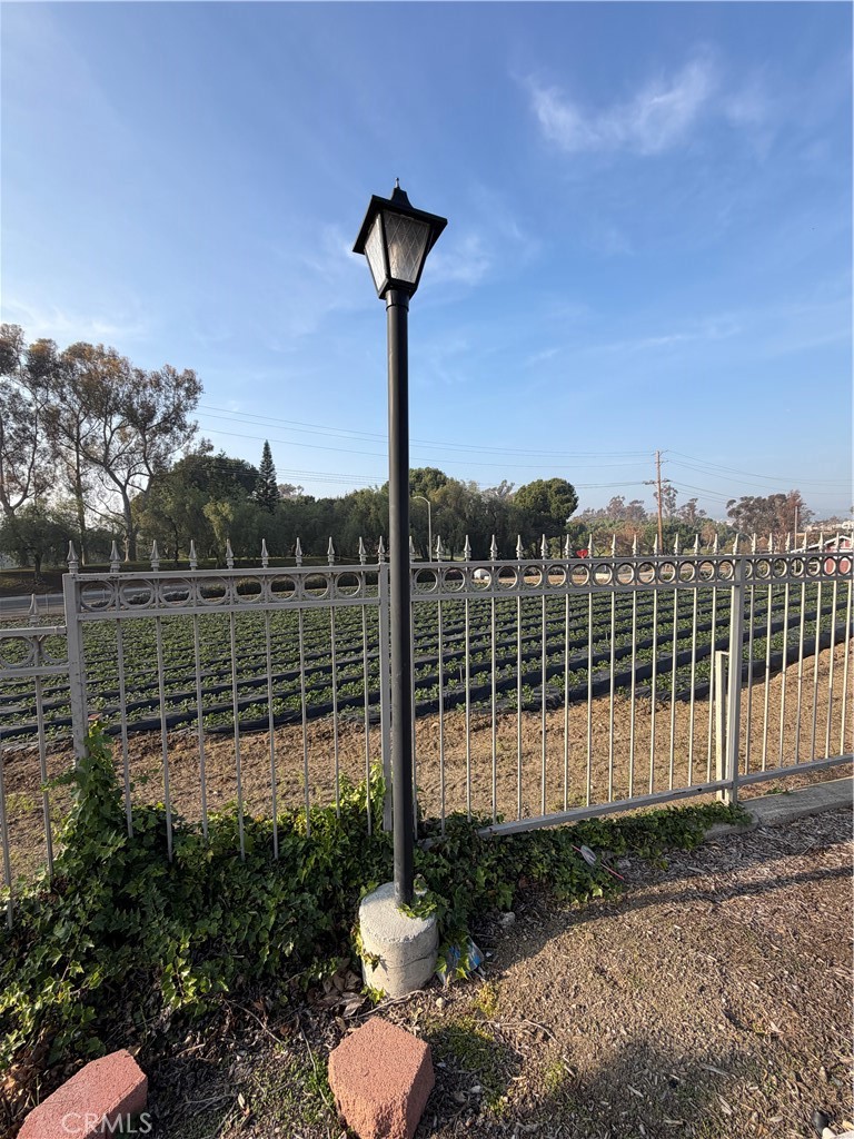 3054 Associated, Unit 20 Fullerton, CA 92835 - Photo 3 of 9 a view of a yard with a wooden fence