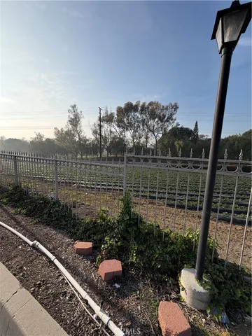 a view of a backyard with sitting area
