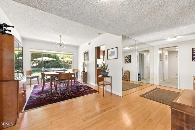 a living room with furniture a window and a table