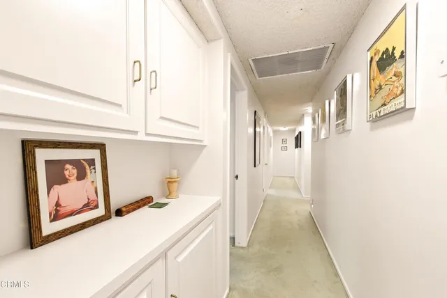 a view of a hallway with hallway and wooden floor