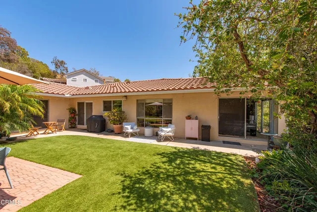 a view of a house with garden and porch