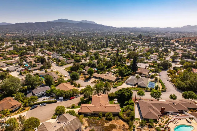 an aerial view of residential houses and street