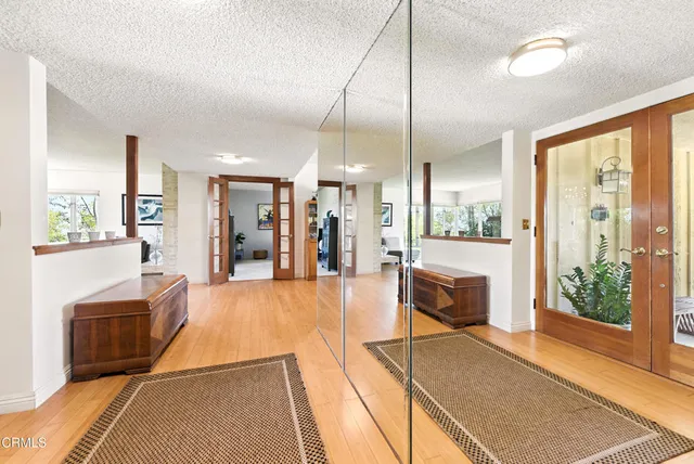 a lobby with furniture and a large window