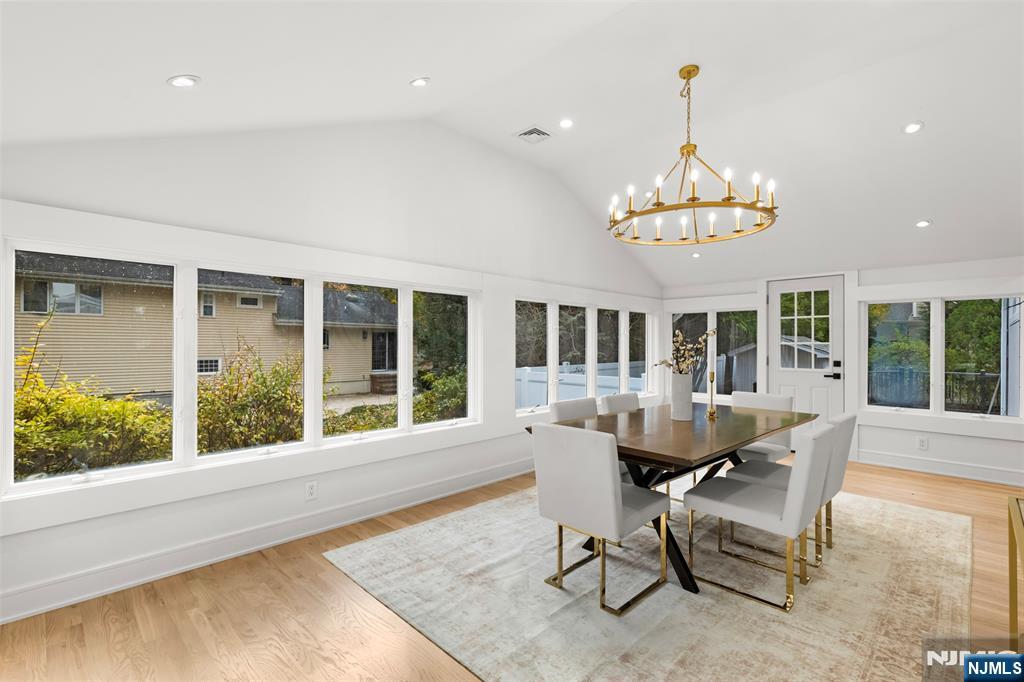 7 Chestnut Place Ho-Ho-Kus, NJ 07423 - Photo 15 of 36 a view of a dining room with furniture wooden floor and a chandelier