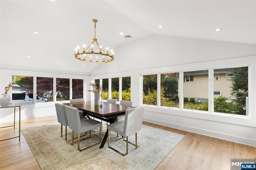 7 Chestnut Place Ho-Ho-Kus, NJ 07423 - Photo 16 of 36 a dining room with furniture a chandelier and wooden floor