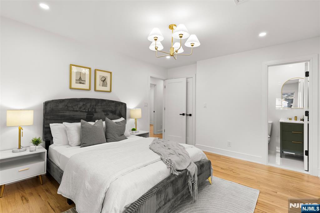 7 Chestnut Place Ho-Ho-Kus, NJ 07423 - Photo 17 of 36 a bedroom with a bed and wooden floor