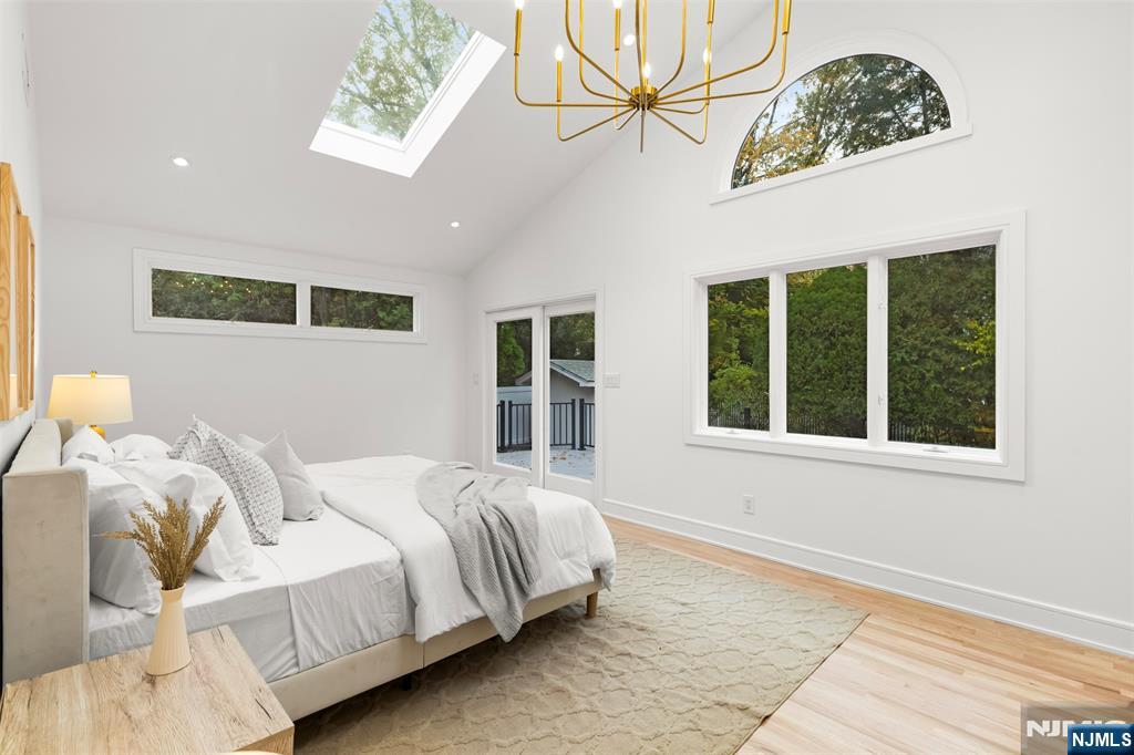 7 Chestnut Place Ho-Ho-Kus, NJ 07423 - Photo 22 of 36 a bedroom with a bed mirror and window