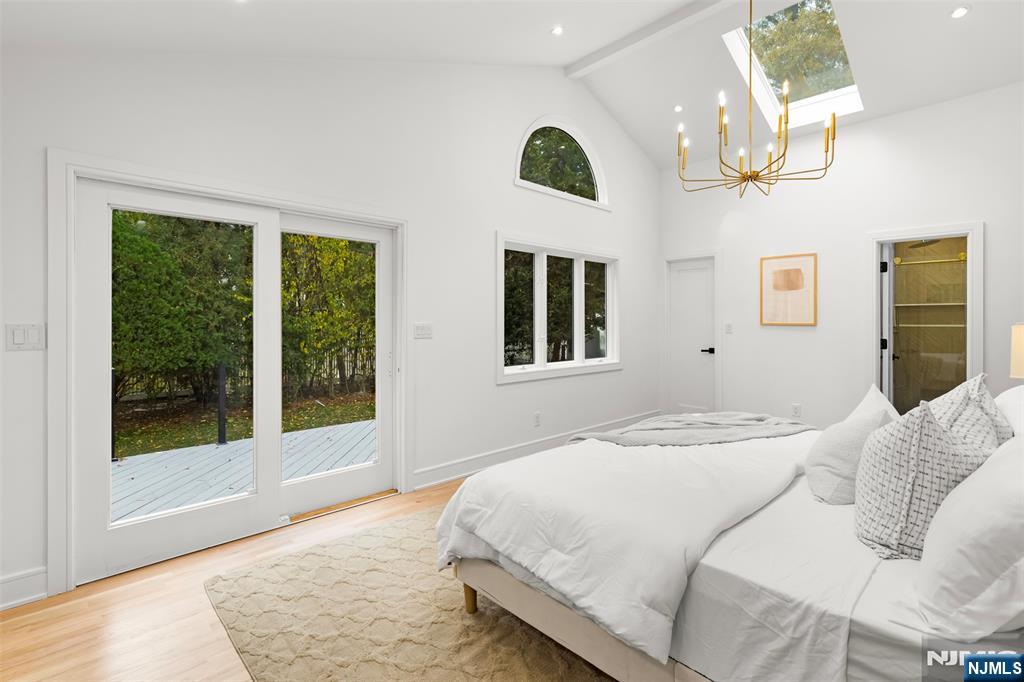 7 Chestnut Place Ho-Ho-Kus, NJ 07423 - Photo 24 of 36 a bedroom with a large bed and a large window