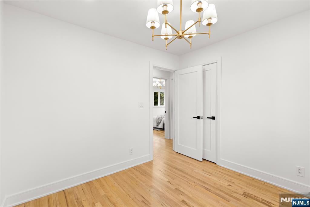 7 Chestnut Place Ho-Ho-Kus, NJ 07423 - Photo 29 of 36 a view of an empty room with wooden floor