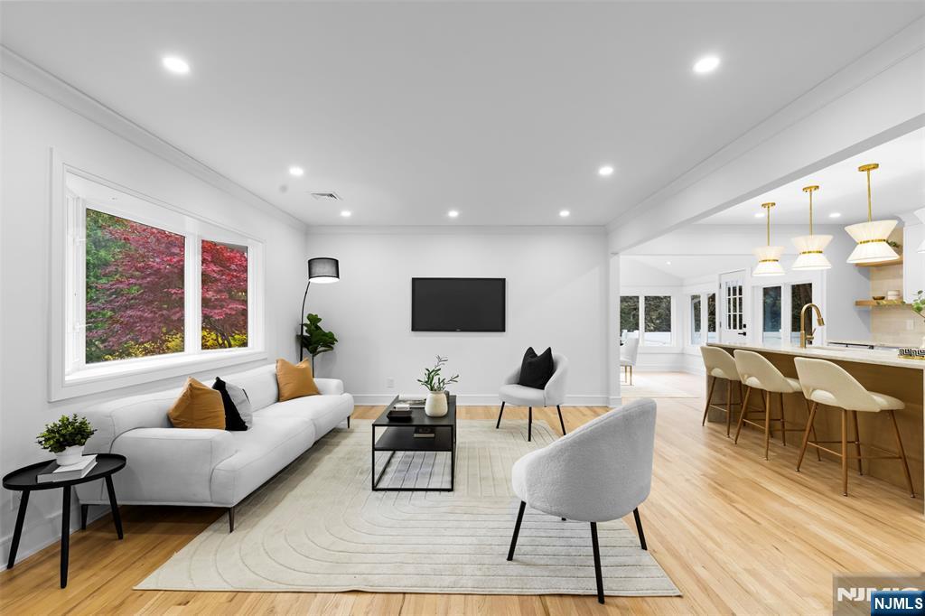 7 Chestnut Place Ho-Ho-Kus, NJ 07423 - Photo 6 of 36 a living room with furniture and a flat screen tv