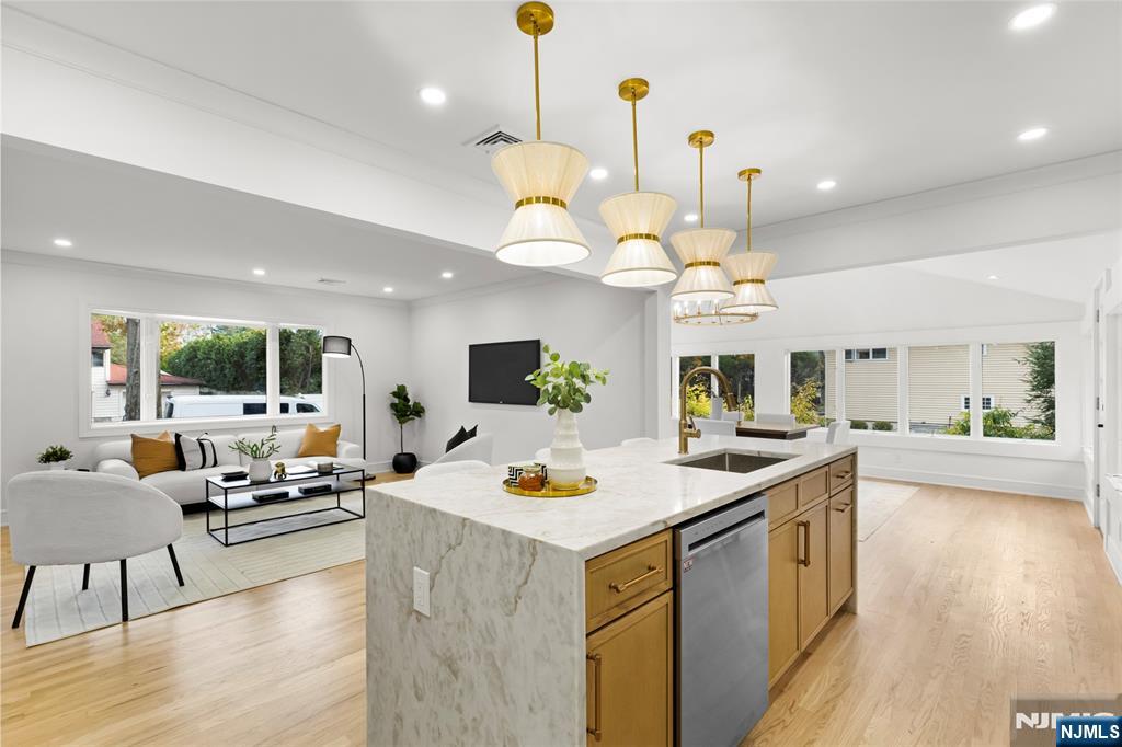 7 Chestnut Place Ho-Ho-Kus, NJ 07423 - Photo 9 of 36 a view of living room with kitchen island furniture and a chandelier