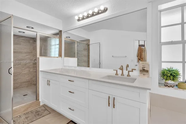 a view of walk in closet with clothes