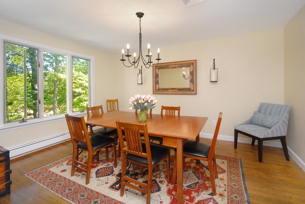 12 South Meadow Ridge, Unit 12 Concord, MA 01742 - Photo 13 of 38 a view of a dining room with furniture window and wooden floor