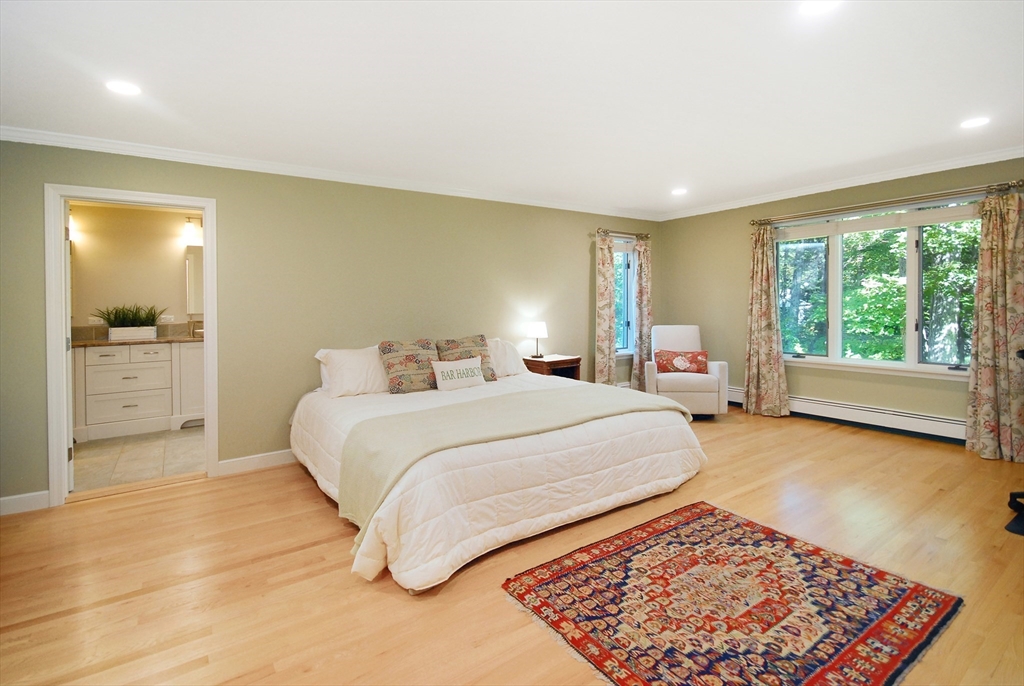 12 South Meadow Ridge, Unit 12 Concord, MA 01742 - Photo 16 of 38 a bedroom with a bed and a large window