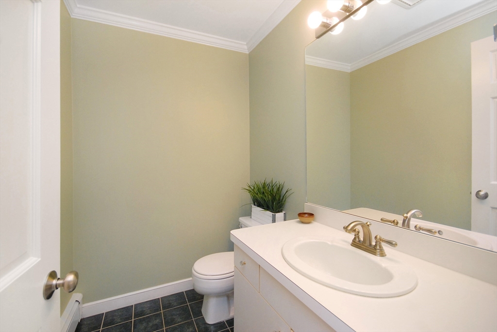 12 South Meadow Ridge, Unit 12 Concord, MA 01742 - Photo 20 of 38 a bathroom with a sink toilet and a mirror