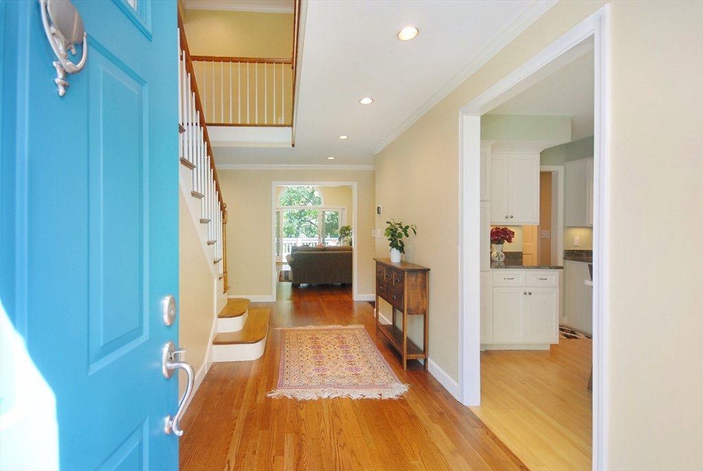 12 South Meadow Ridge, Unit 12 Concord, MA 01742 - Photo 2 of 38 a view of a hallway with wooden floor windows and livingroom