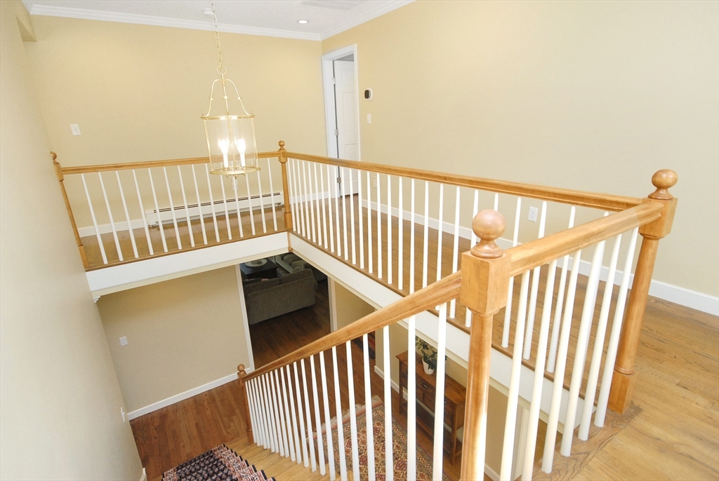 12 South Meadow Ridge, Unit 12 Concord, MA 01742 - Photo 23 of 38 a view of staircase with railing and white walls
