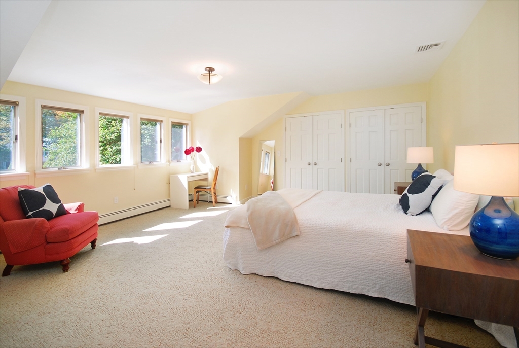 12 South Meadow Ridge, Unit 12 Concord, MA 01742 - Photo 25 of 38 a bedroom with a bed and a couch