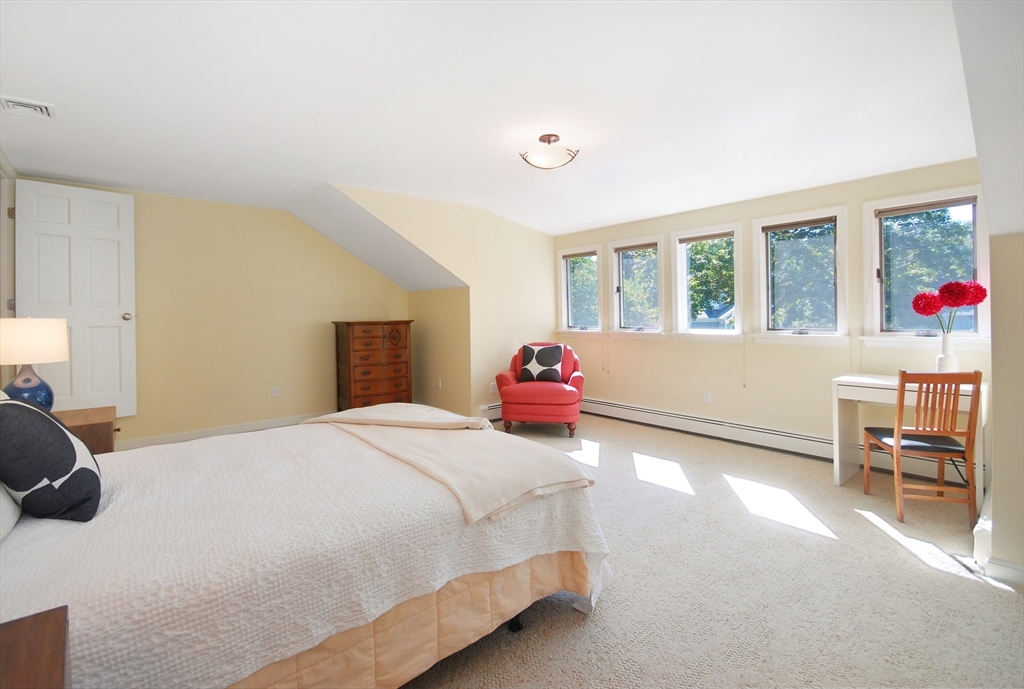 12 South Meadow Ridge, Unit 12 Concord, MA 01742 - Photo 26 of 38 a bedroom with a bed and furniture