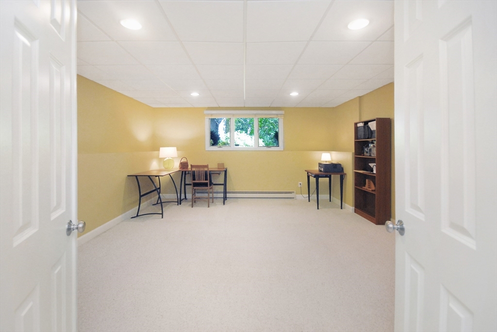 12 South Meadow Ridge, Unit 12 Concord, MA 01742 - Photo 29 of 38 a view of a livingroom with furniture and window