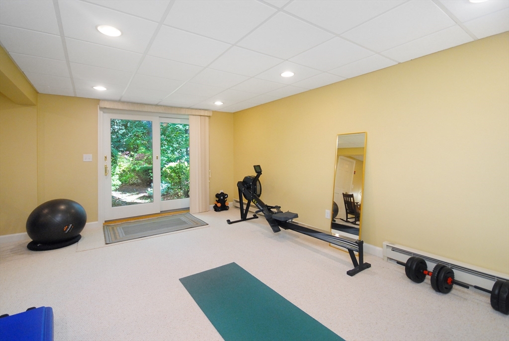 12 South Meadow Ridge, Unit 12 Concord, MA 01742 - Photo 31 of 38 a view of a room with gym equipment