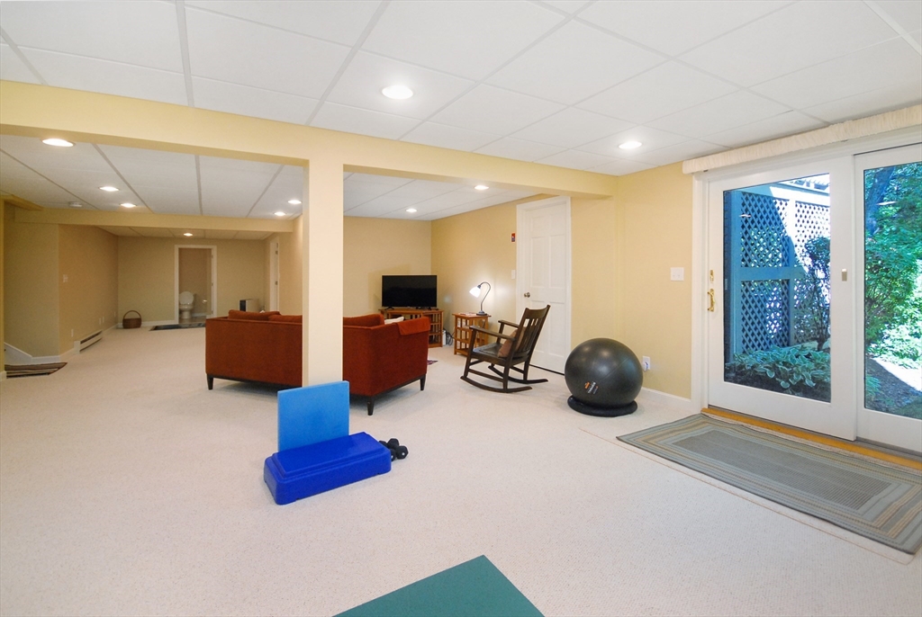 12 South Meadow Ridge, Unit 12 Concord, MA 01742 - Photo 32 of 38 a room with furniture and a large window