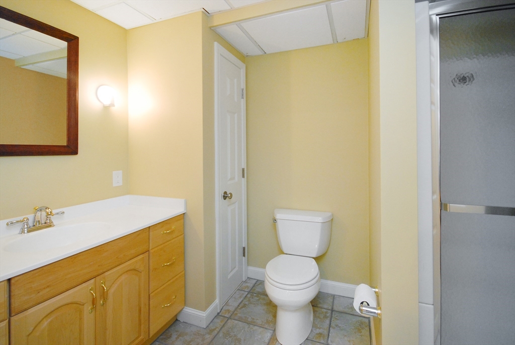 12 South Meadow Ridge, Unit 12 Concord, MA 01742 - Photo 34 of 38 a bathroom with a sink a toilet and shower